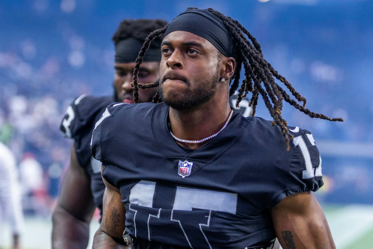 Raiders wide receiver Davante Adams (17) runs off the field following the second half of their ...