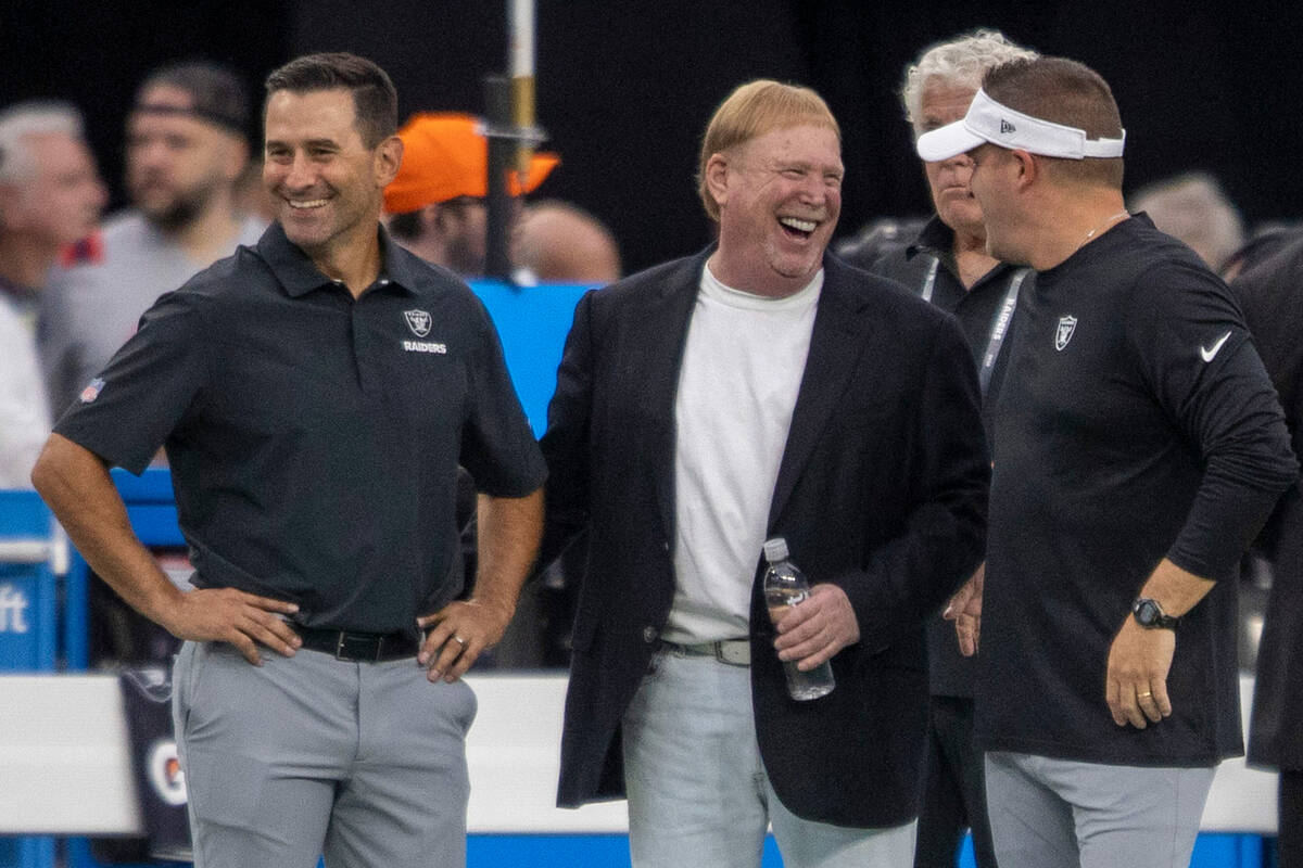 Raiders general manager Dave Ziegler, left, owner Mark Davis, center, and head coach Josh McDan ...