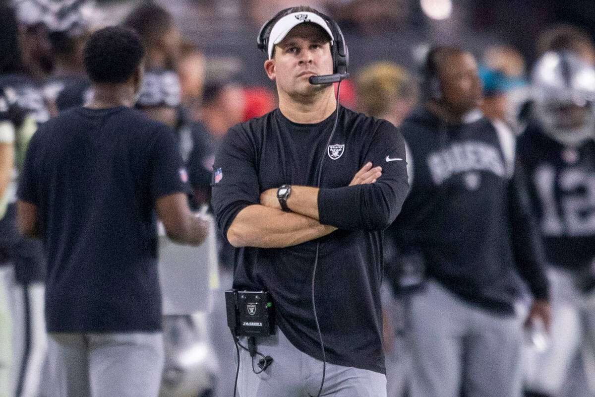 Raiders head coach Josh McDaniels walks the sideline during the second half of an NFL game agai ...