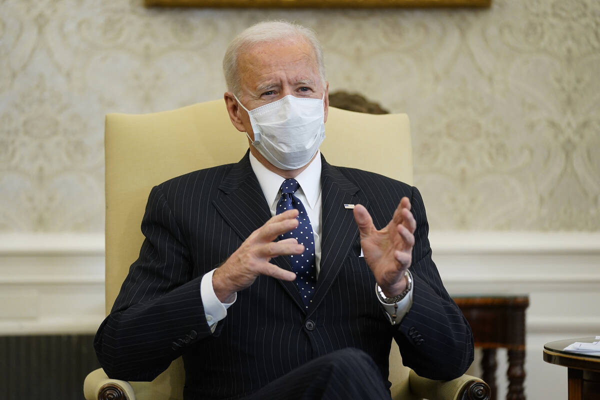In this Feb. 9, 2021, photo, President Joe Biden meets with business leaders to discuss a coron ...