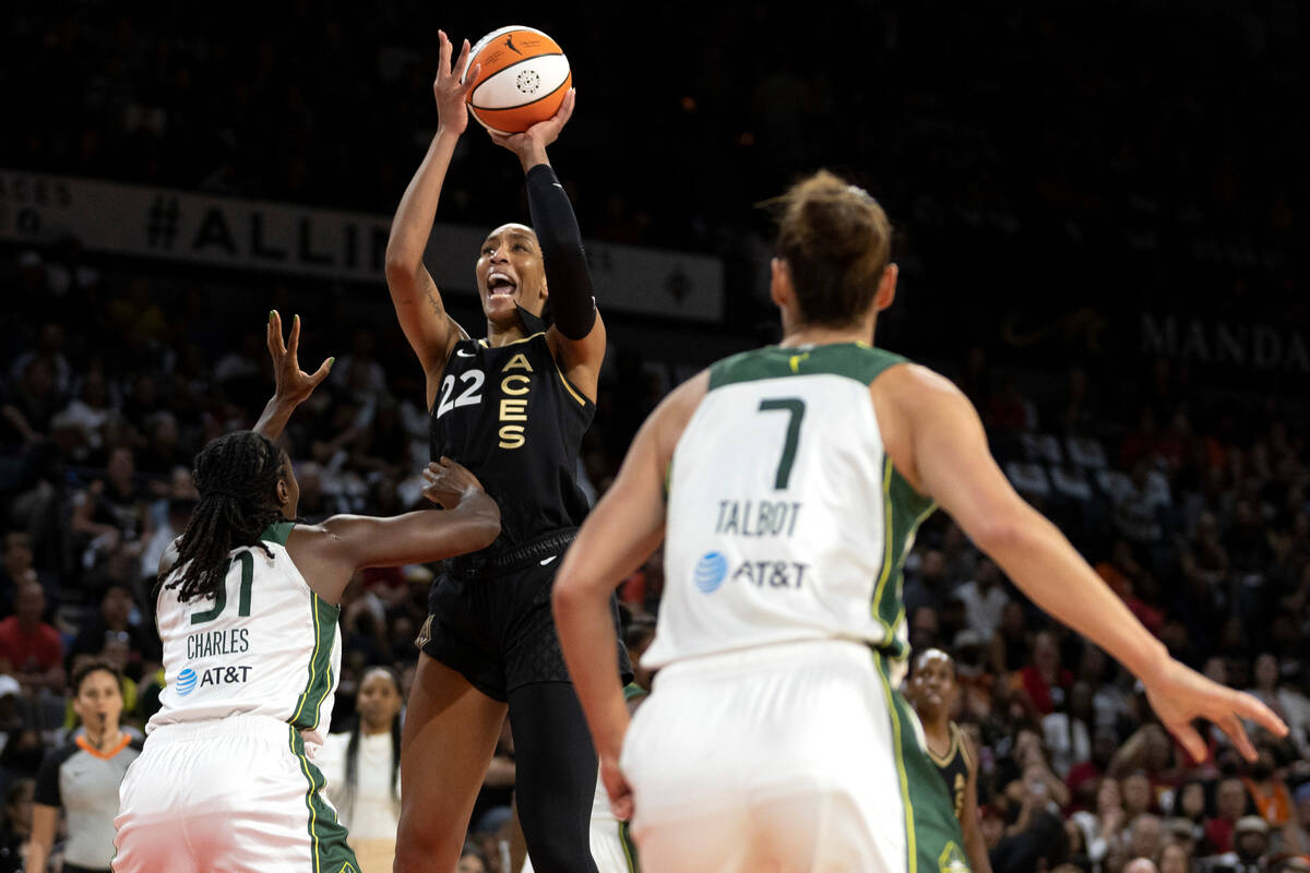 Las Vegas Aces forward A'ja Wilson (22) shoots against Seattle Storm center Tina Charles (31) a ...