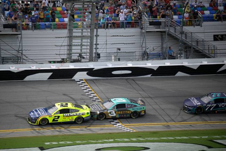 Austin Cindric (2), Austin Dillon (3) and Landon Cassil (77) drive on the front stretch during ...
