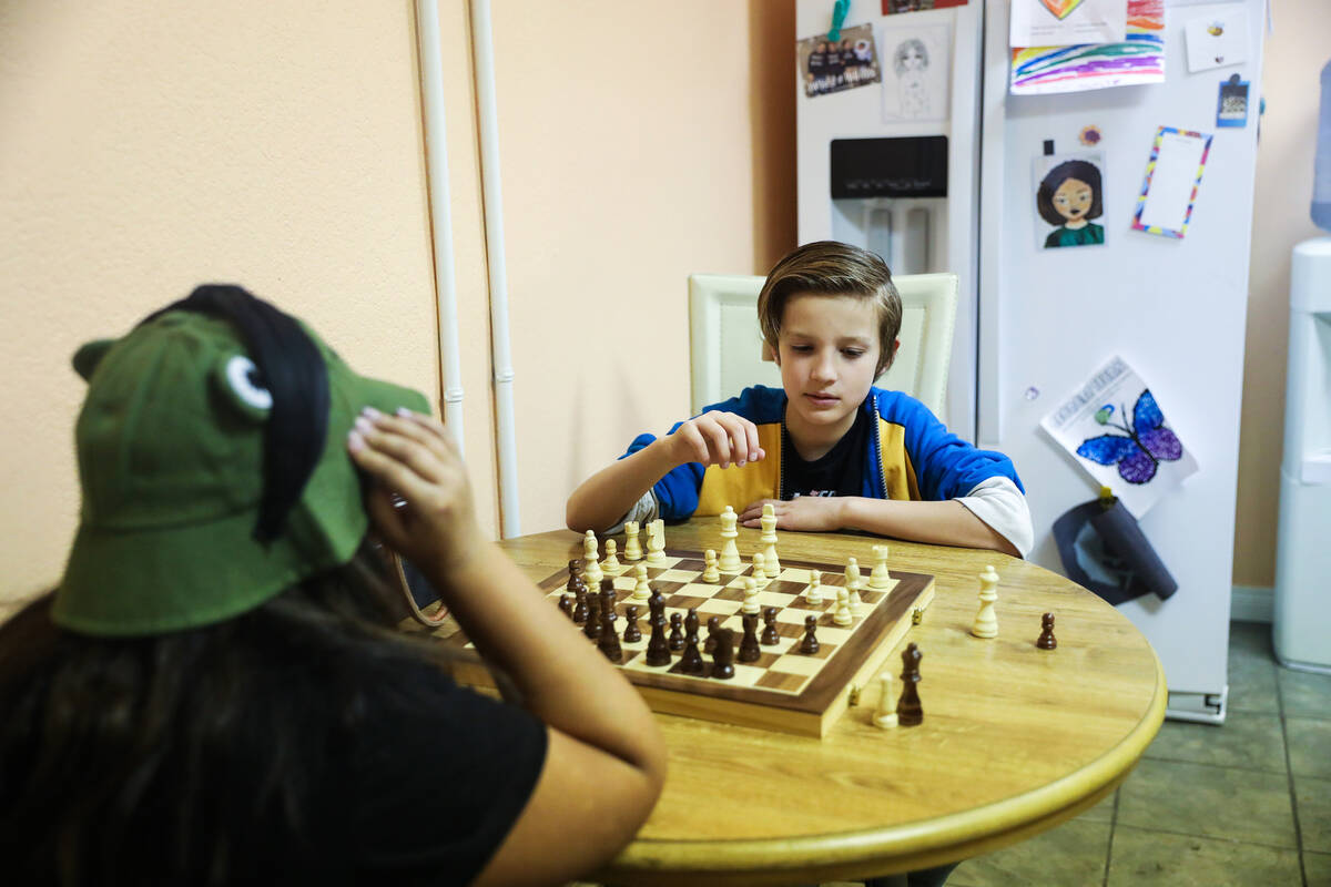 Izzy Delon, 10, left, plays chess with Calvin Campbell, 11, right, at Bloom Academy in Las Vega ...