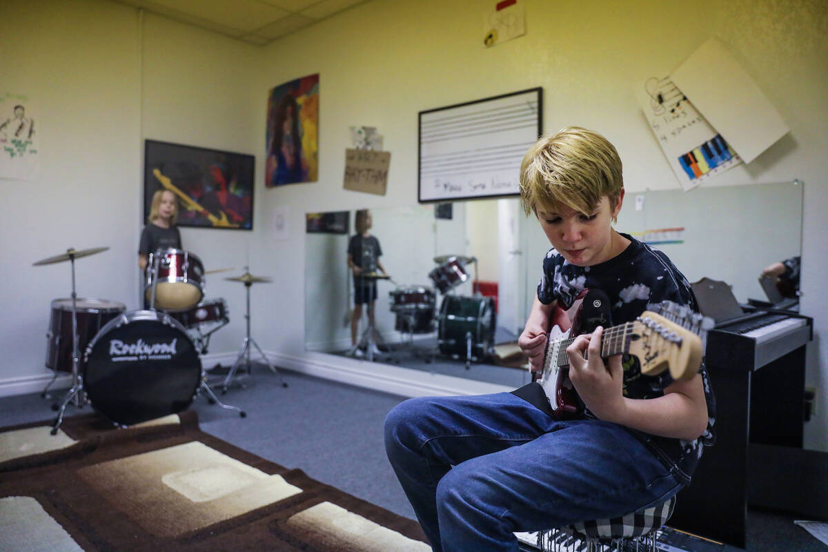 Dan Petit, 12, plays guitar at Bloom Academy in Las Vegas on Aug. 31, 2022. Bloom Academy is a ...