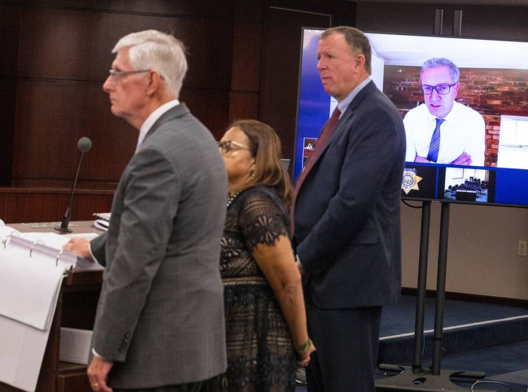 Attorney Dan Reiser, left, Wanda Wilson, independent director of the compliance committee, and ...