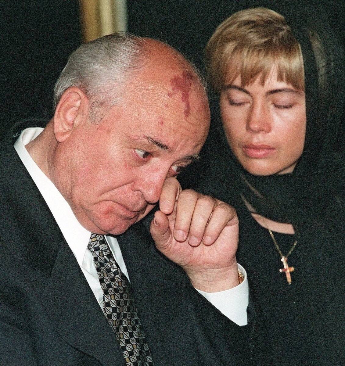 FILE - Former Soviet president Mikhail Gorbachev wipes away tears next to his daughter Irina VI ...