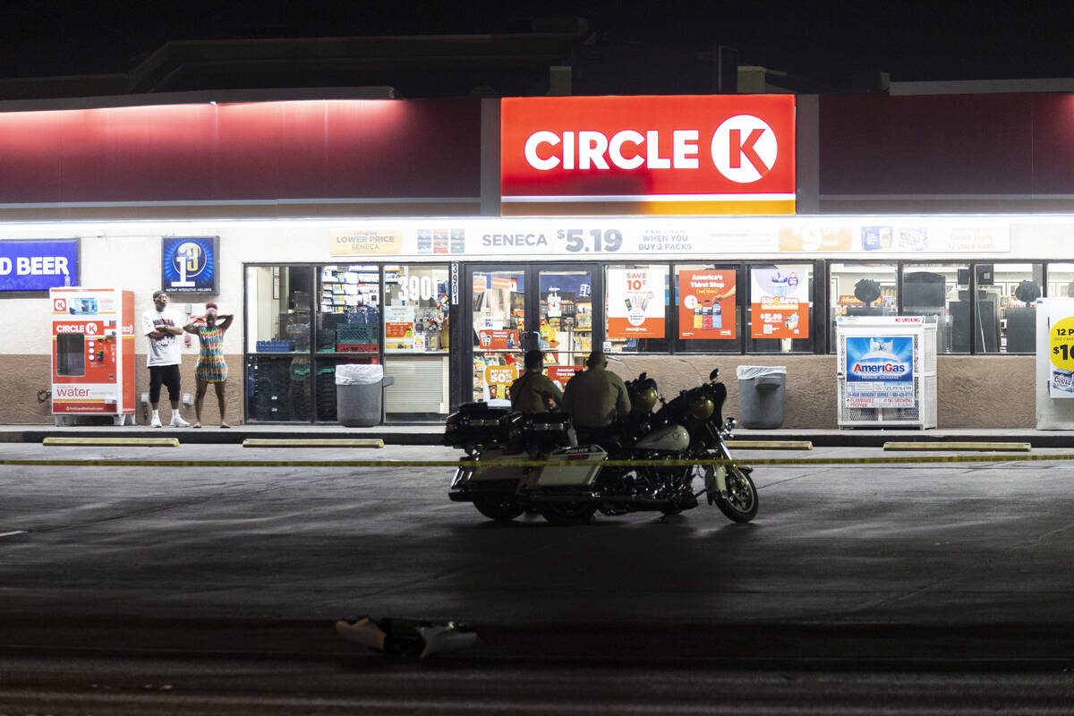 Las Vegas police investigate the scene of an accident involving a police motorcycle officer at ...