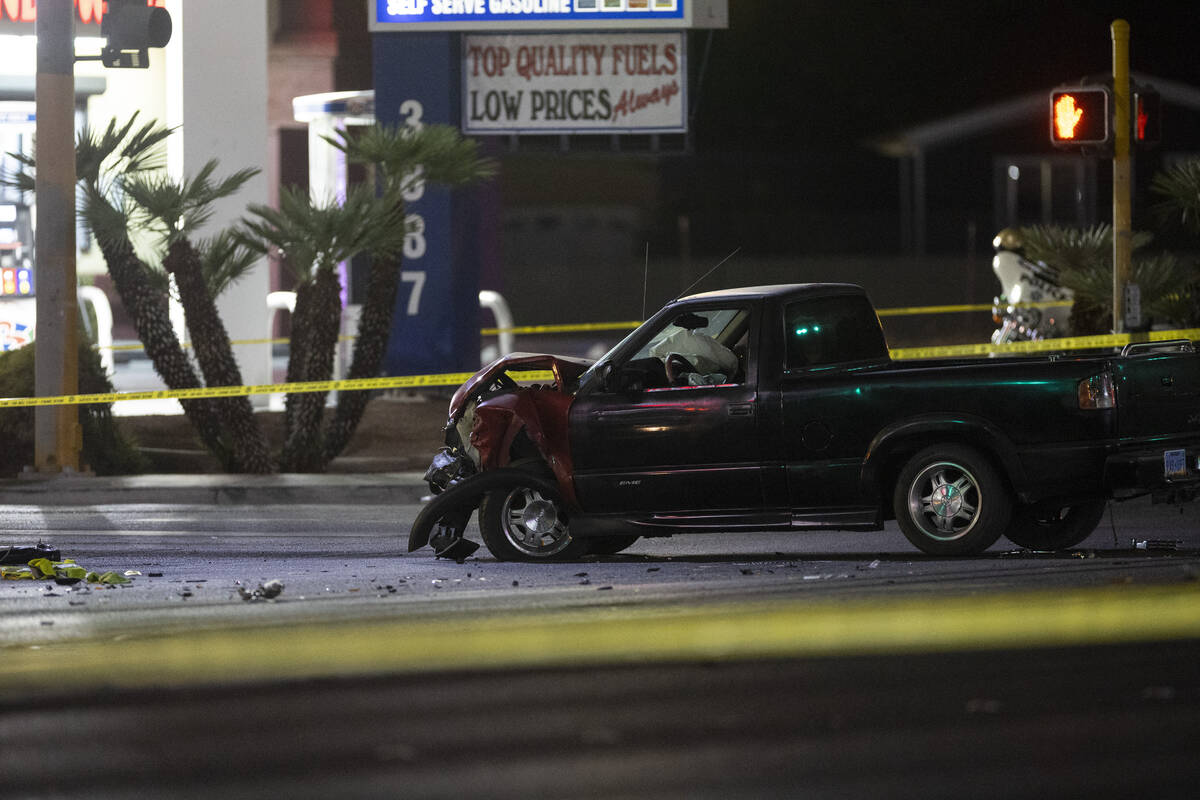 Las Vegas police investigate the scene of an accident involving a police motorcycle officer at ...