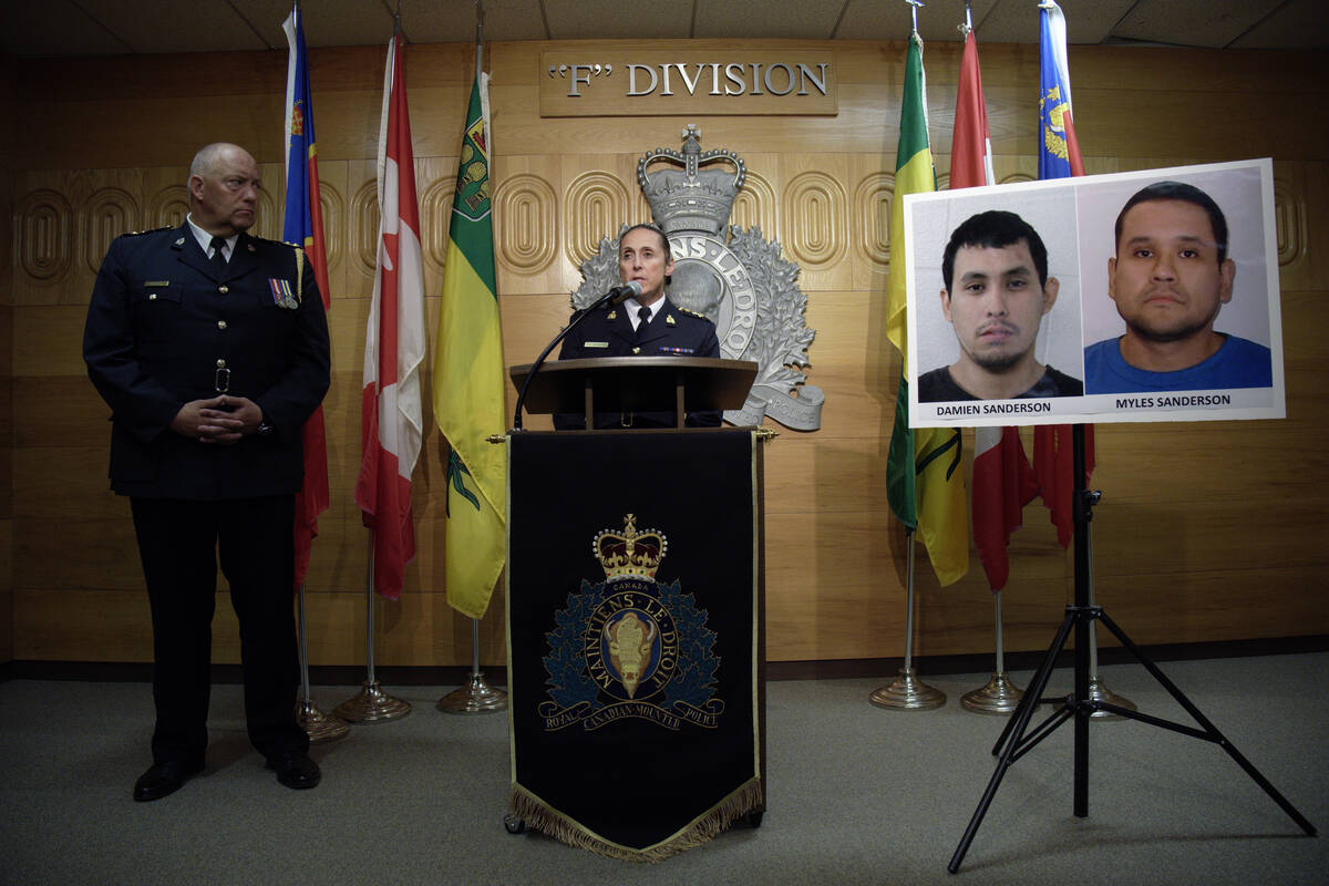 Assistant Commissioner Rhonda Blackmore speaks while Regina Police Chief Evan Bray, left, looks ...