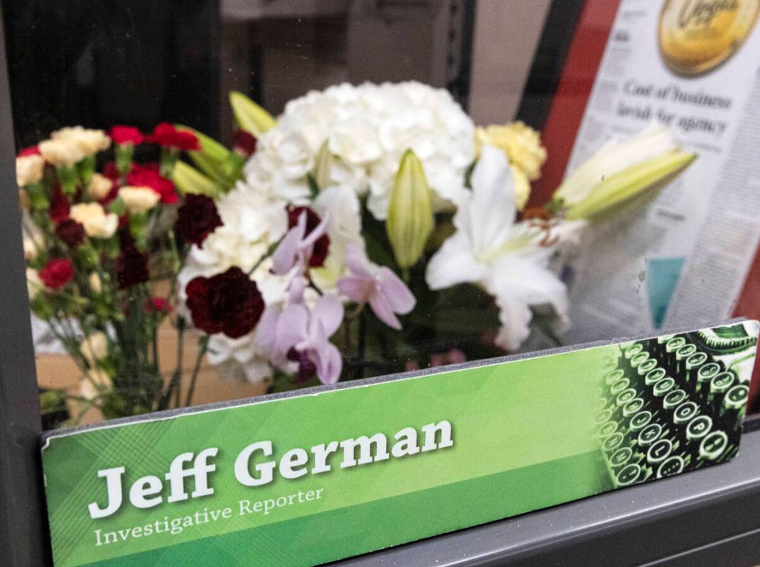 Flowers are placed on the desk of Jeff German, a Review-Journal investigative reporter, on Tues ...