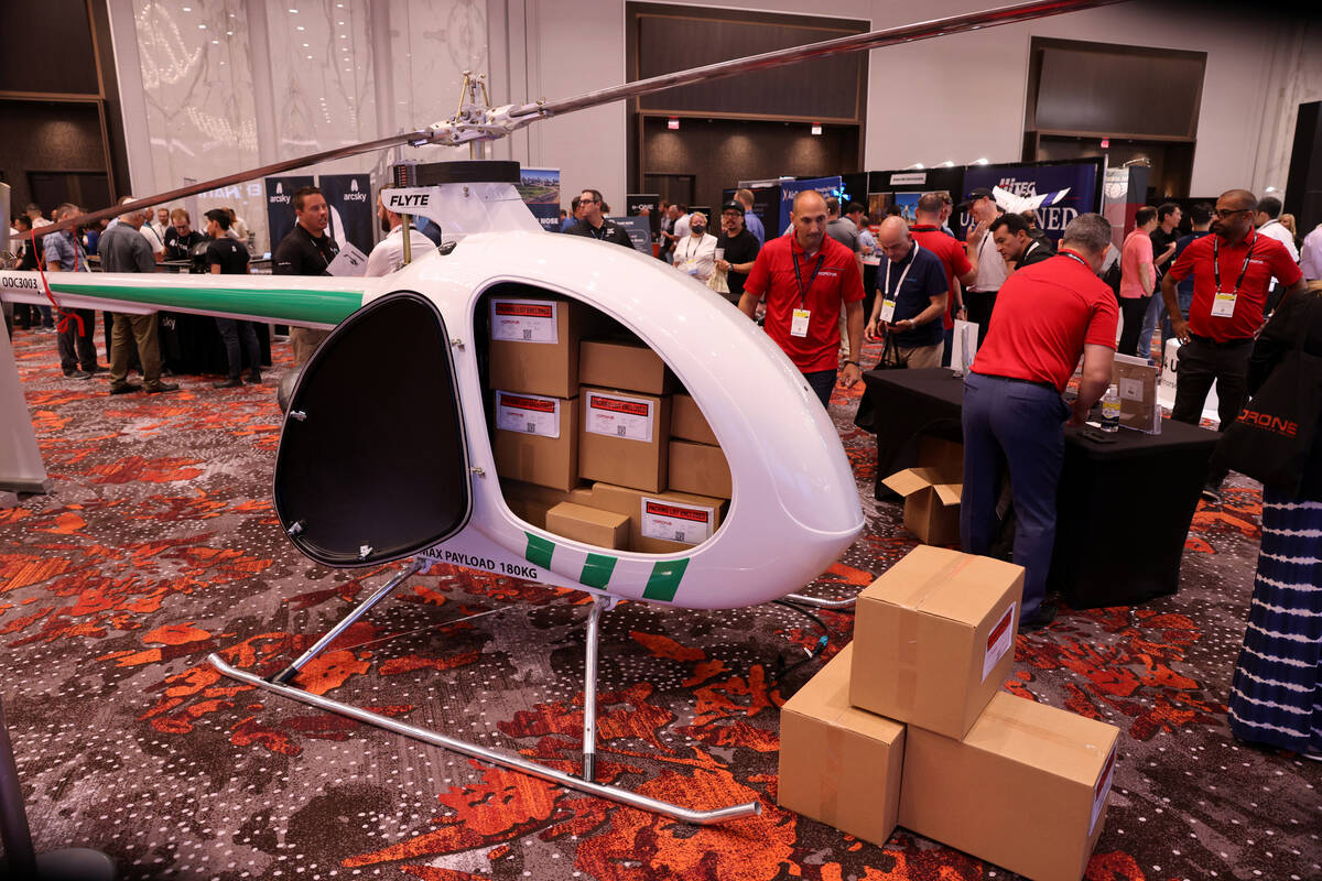 FILE -A cargo drone helicopter, capable of carrying 400 pounds, on display at the Drone Deliver ...