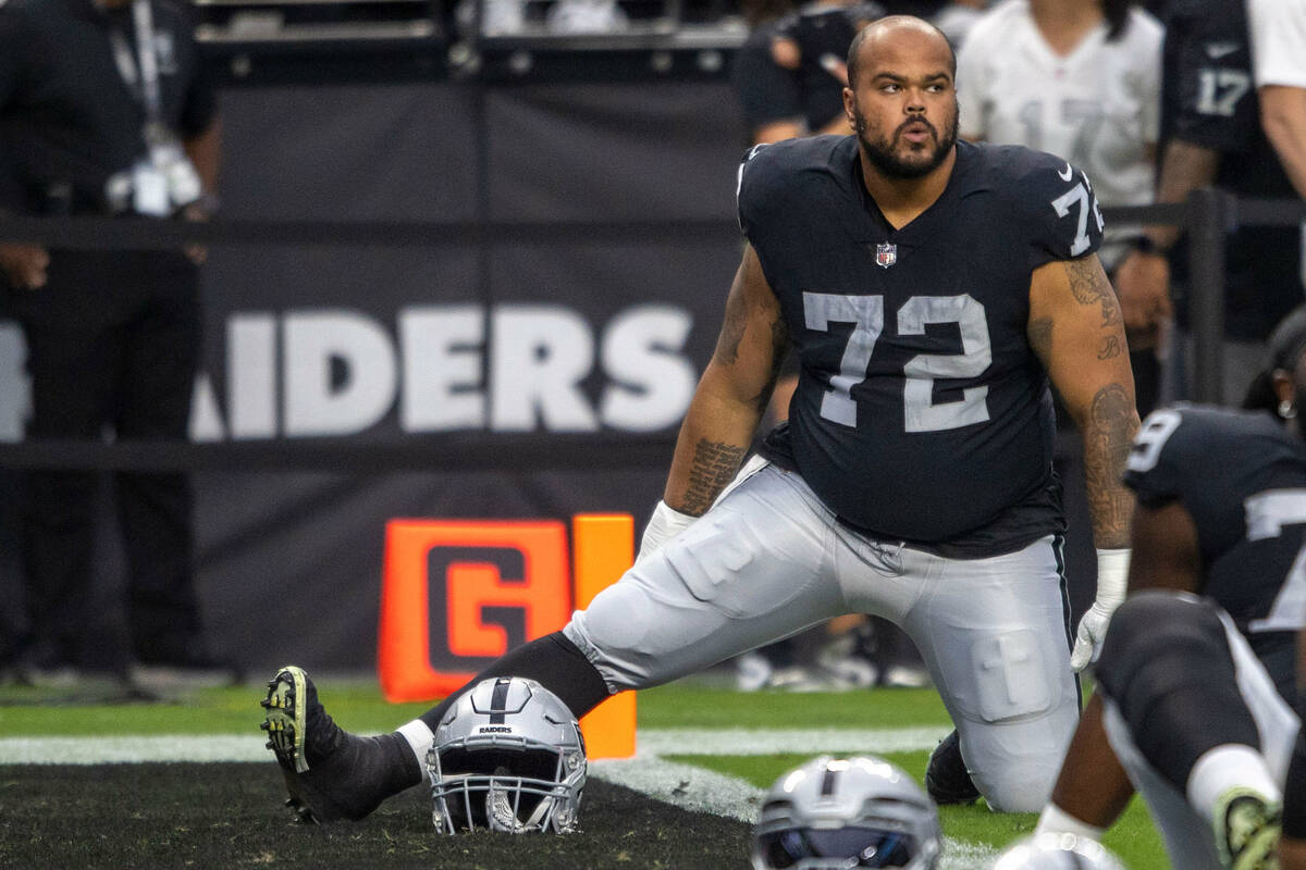 Raiders offensive lineman Jermaine Eluemunor (72) stretches before an NFL game at Allegiant Sta ...