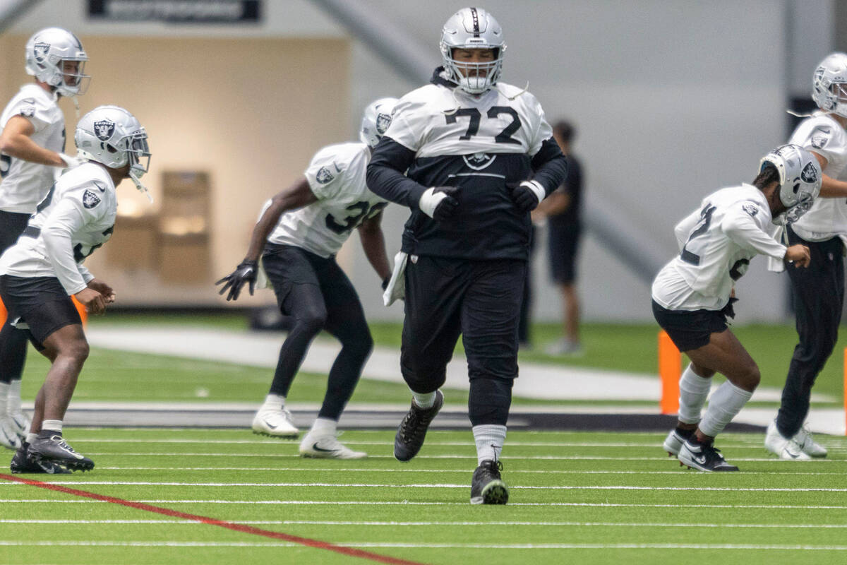 Raiders offensive lineman Jermaine Eluemunor (72) runs during practice at the Intermountain Hea ...