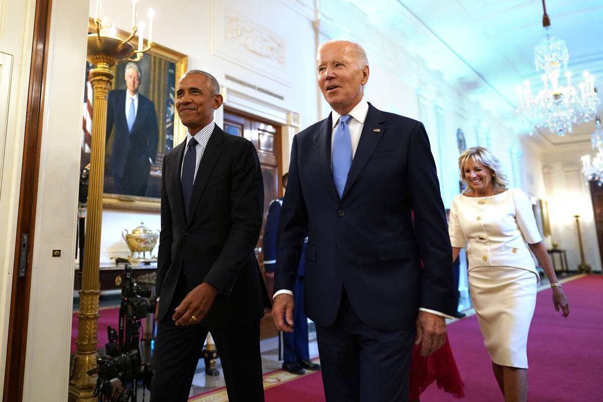 U.S. President Joe Biden, with first lady Jill Biden, and former President Barack Obama, with f ...