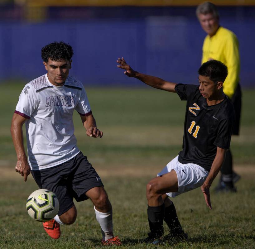 Cimarron-Memorial’s Nain Navarro, left, steals the ball from Durango’s Anthony Lo ...