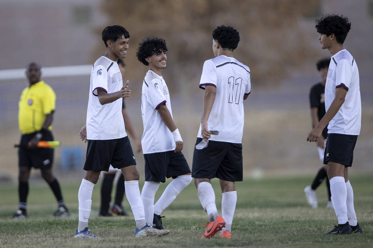 Cimarron-Memorial players celebrate after winning a high school soccer game against Durango at ...