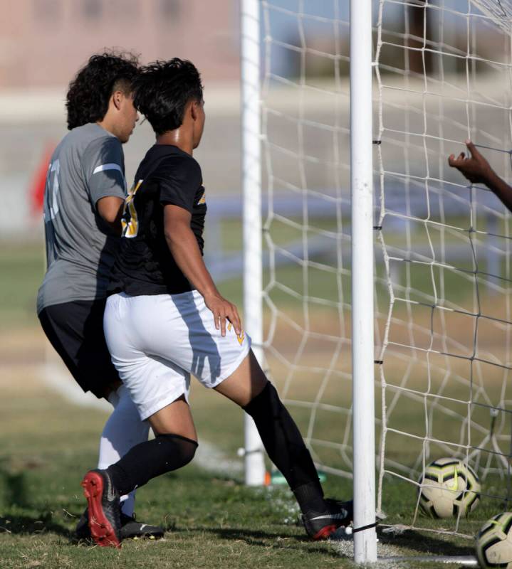 Durango’s Ritchard Miranda (27) scores a goal on Cimarron-Memorial goalkeeper Anthony Ce ...