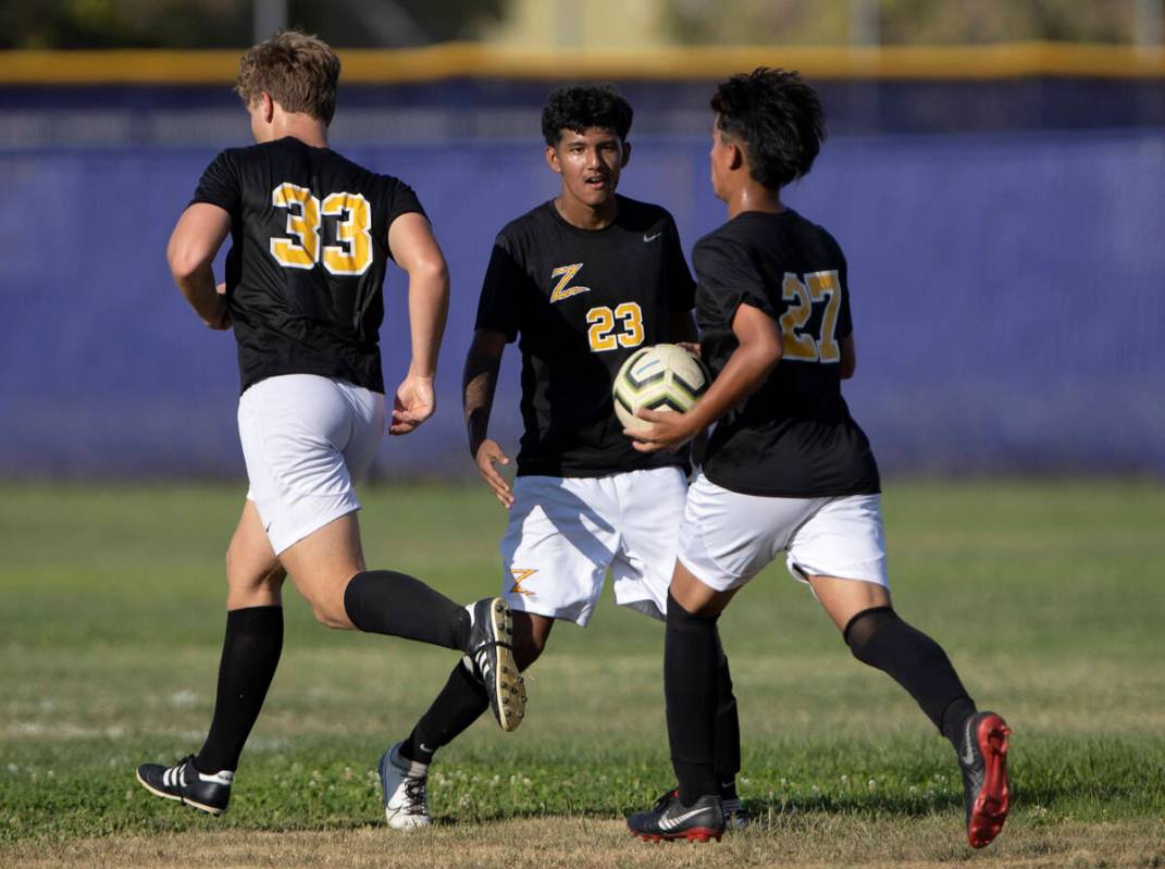 Durango’s Donovan Rangel (23) congratulates his teammate Ritchard Miranda (27) after Mir ...