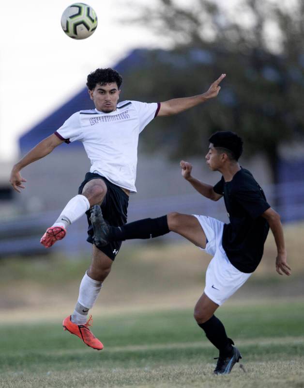 Cimarron-Memorial’s Nain Navarro, left, kicks the ball against Durango’s Anthony ...