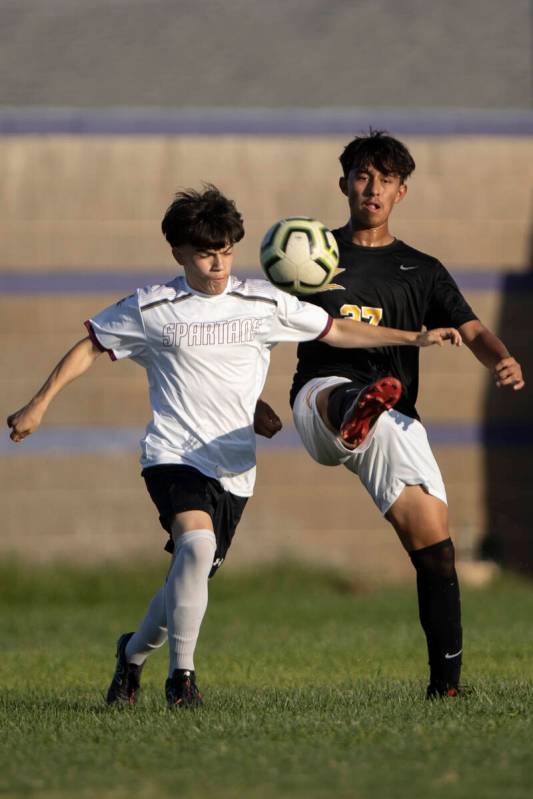 Cimarron-Memorial’s Miguel Pina, left, collides with Durango’s Ritchard Miranda ( ...