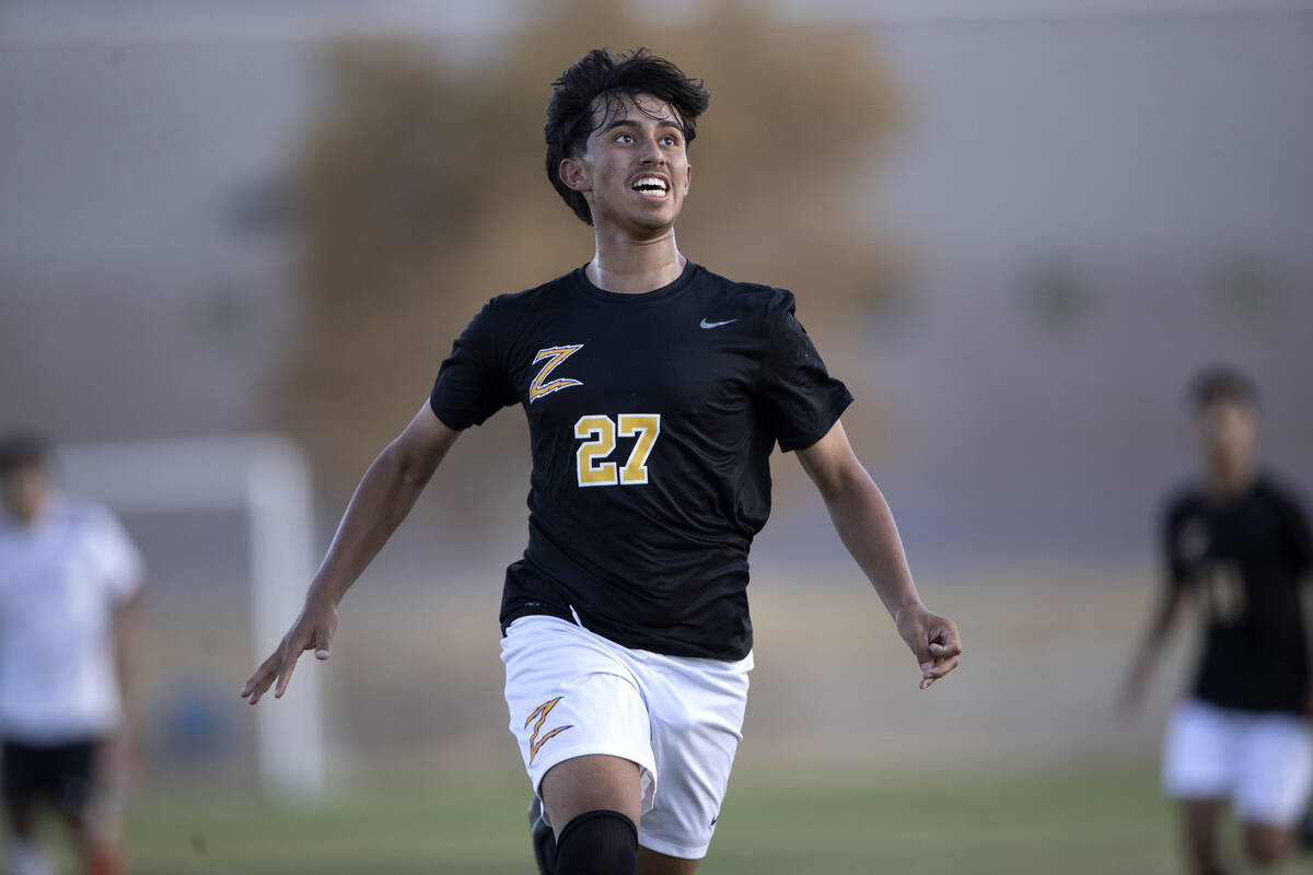 Durango’s Ritchard Miranda (27) keeps his eyes on the ball while running for possession ...