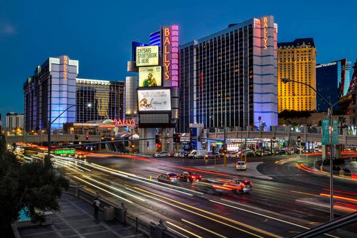 Cars stream along East Flamingo Road near the exterior of Bally’s Las Vegas which will be reb ...