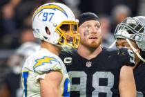 Los Angeles Chargers defensive end Joey Bosa (97) and Raiders defensive end Maxx Crosby (98) sp ...