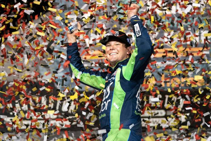 Erik Jones celebrates in the Winner's Circle after the NASCAR Southern 500 auto race Sunday, Se ...