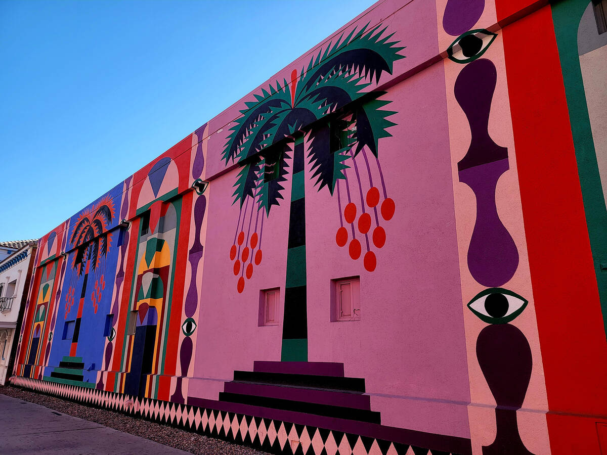 Italian artist Agostino Iacurci’s vibrant arched doorways, trees and columns in a mural ...