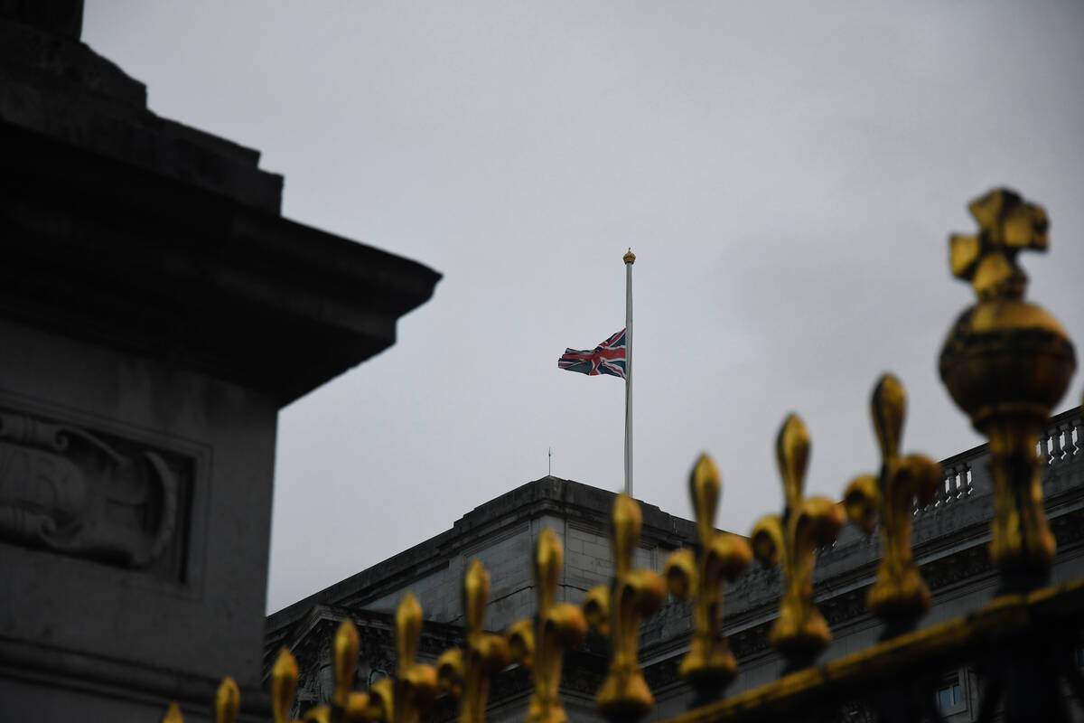 Britain's flag, lowered to half-staff, flies outside Buckingham Palace on Thursday, Sept. 8, 20 ...