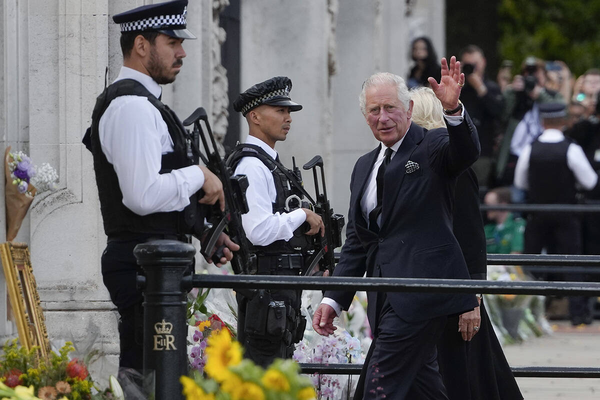 King Charles III and Camilla, the Queen Consort, arrive at Buckingham Palace in London, Friday, ...