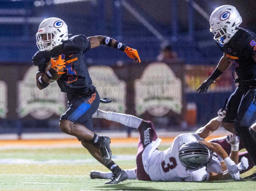 Bishop Gorman running back Devon Rice (3) breaks into open field after missed tackle by Hamilto ...