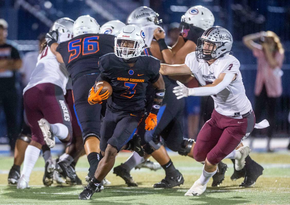 Bishop Gorman running back Devon Rice (3) breaks into open field after missed tackle by Hamilto ...