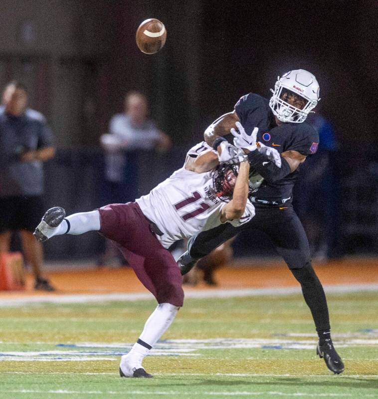 Hamilton wide receiver Jaxon Haynes (11) has a pass broken up by Bishop Gorman defensive back E ...