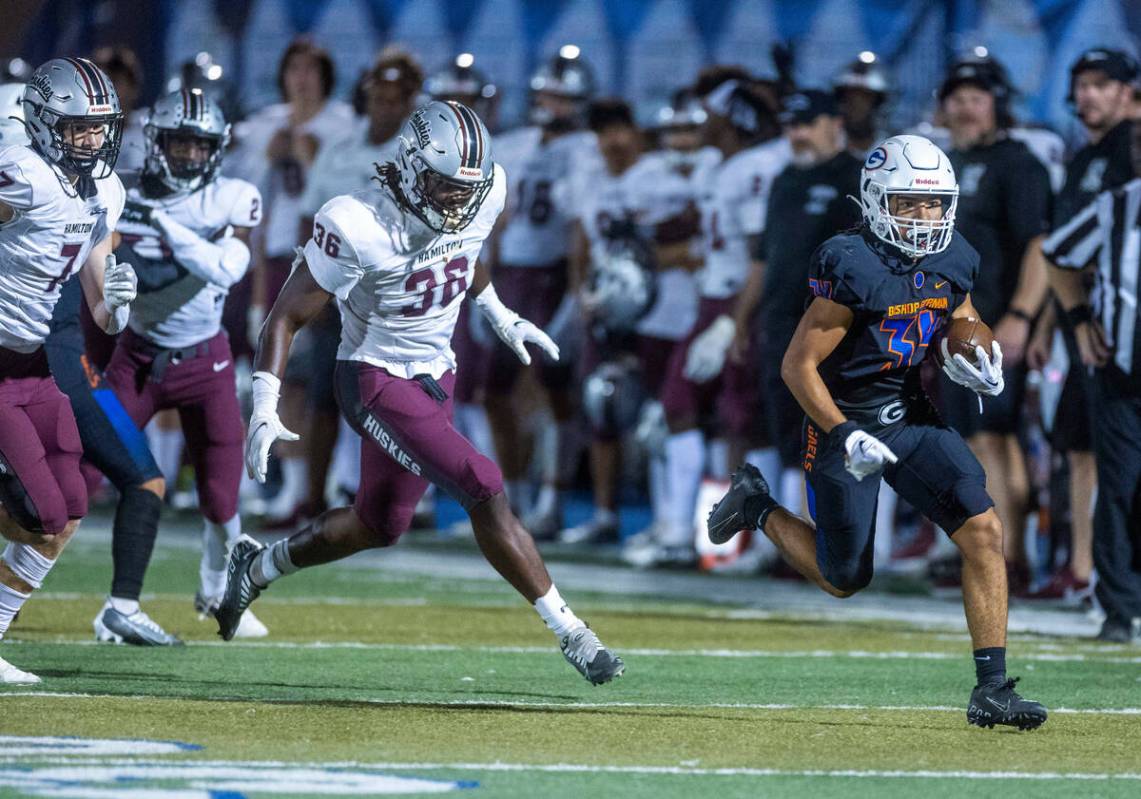 Bishop Gorman running back Myles Norman (34) heads towards the end zone pursued by Hamilton lin ...