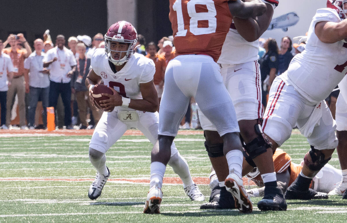 Alabama quarterback Bryce Young looks to run during the second half an NCAA college football ga ...