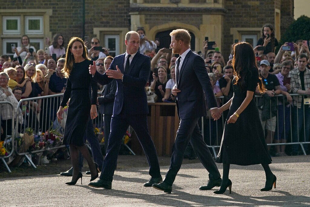 Britain's Prince William and Kate, Princess of Wales, left, and Britain's Prince Harry and Megh ...