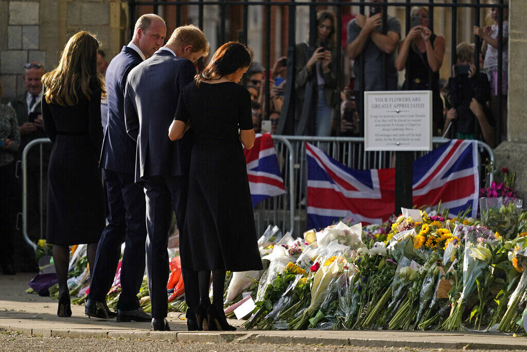 Britain's Prince William and Kate, Princess of Wales, left, and Britain's Prince Harry and Megh ...