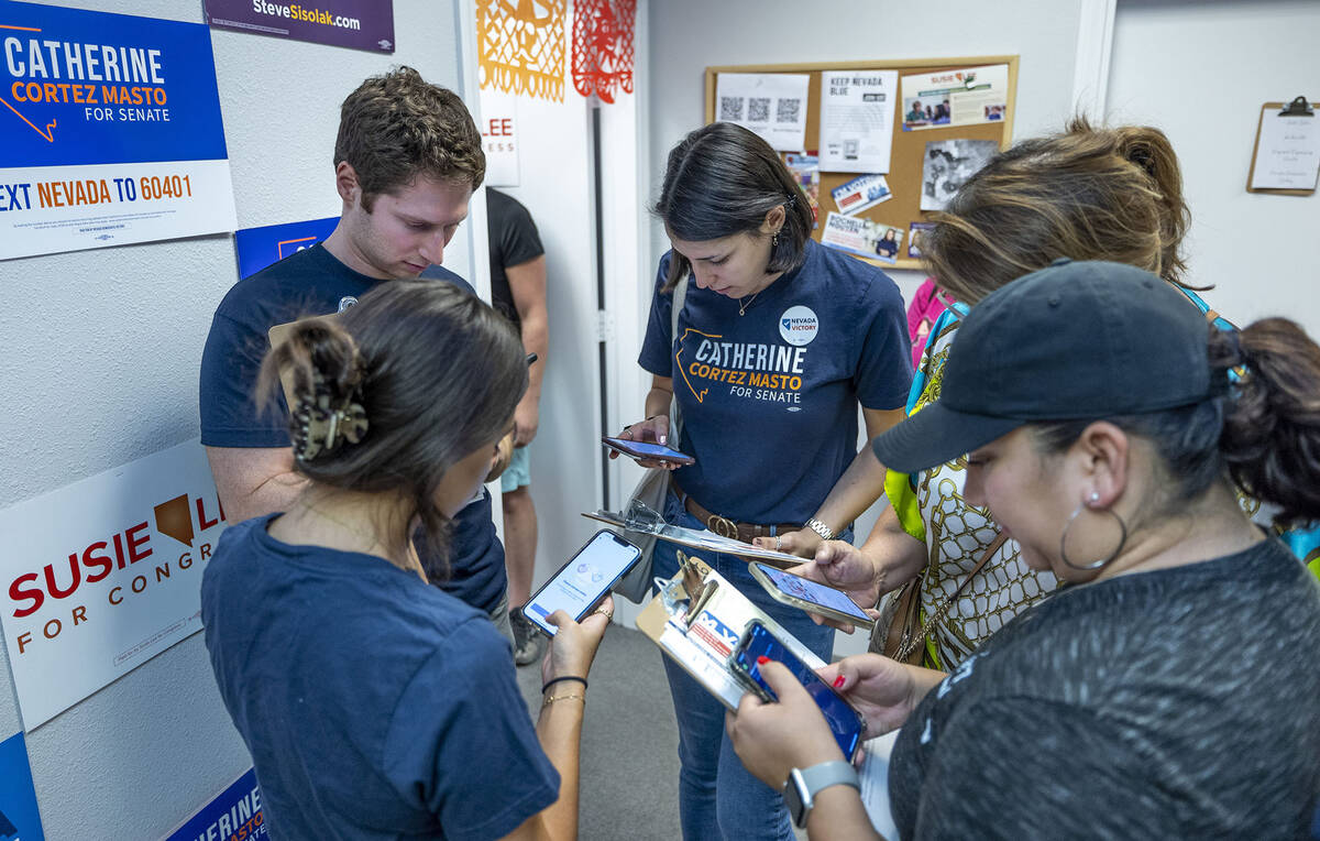 Election workers on behalf of Senator Cortez Masto gather for a game plan on canvassing followi ...