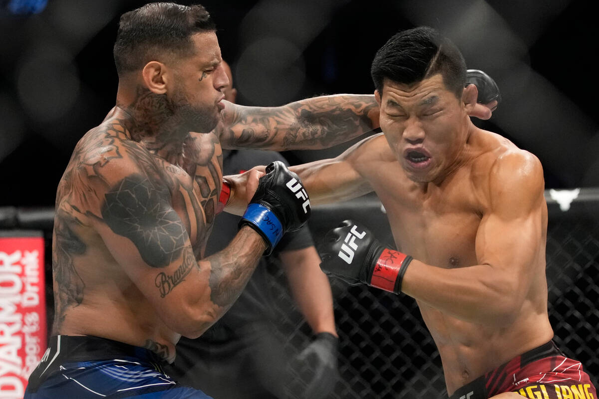 Li Jingliang, right, fights Daniel Rodriguez in a 180-pound catchweight bout during the UFC 279 ...