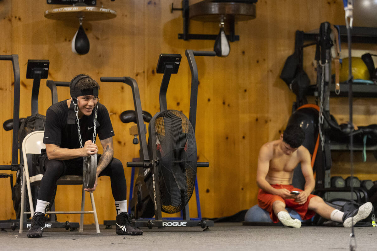 Boxer Jesse "Bam" Rodriguez, left, pauses during a training camp workout at the Rober ...