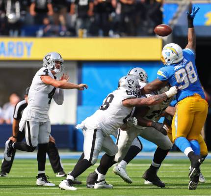 Raiders quarterback Derek Carr (4) throws the ball during the second half of a NFL football gam ...