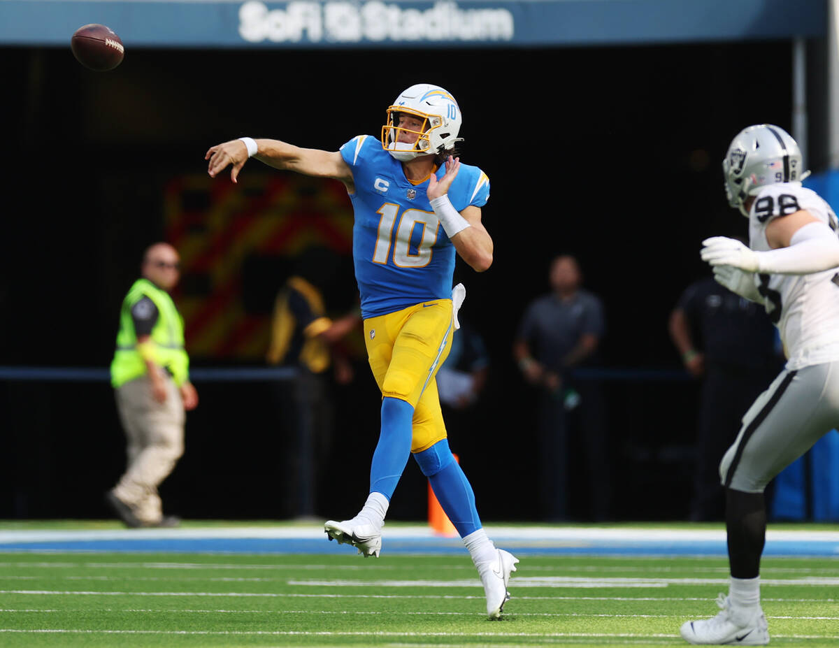 Los Angeles Chargers quarterback Justin Herbert (10) makes a pass during the second half of a N ...