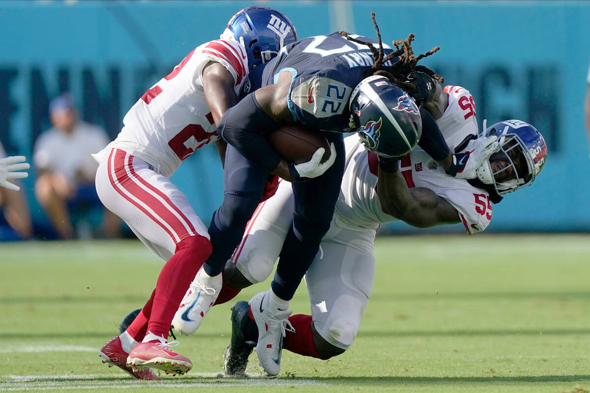 Tennessee Titans running back Derrick Henry (22) is taken down by New York Giants cornerback Ad ...