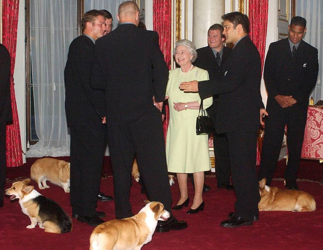 FILE - Britain's Queen Elizabeth II meets the New Zealand All Blacks rugby team will the royal ...