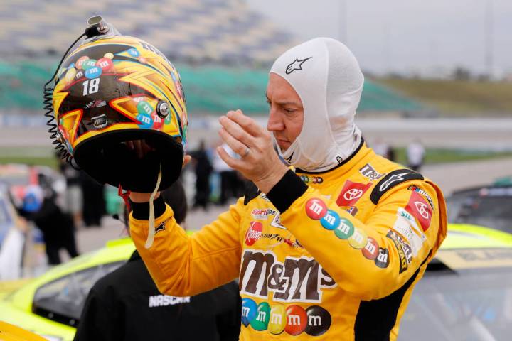 Kyle Busch removes his helmet after making a run during qualifying for a NASCAR Cup Series auto ...