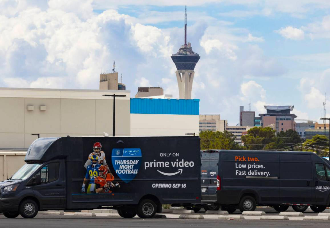 Amazon delivery vans are parked outside of Amazon warehouse at 650 E. Owens Ave., on Tuesday, S ...