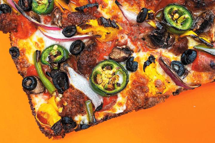 Guerilla Pizza, the signature Detroit-style pizza of Hard Hat Lounge in Las Vegas, began in the ...
