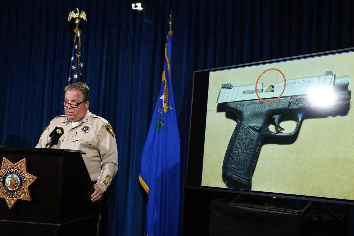 Las Vegas police Assistant Sheriff John McGrath shows a jammed weapon he said belonged to Gabri ...
