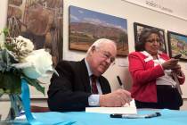 Former independent counsel Kenneth Starr signs a copy of his recent book "Contempt: A Memo ...